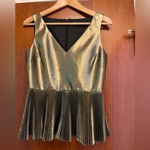 Sleeveless gold pleated peplum top
